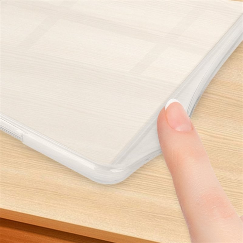 Close-up of a frosted clear TPU corner being flexed by a finger